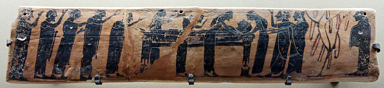 Ancient Greek funerary plaque showing mourners around the deceased.
