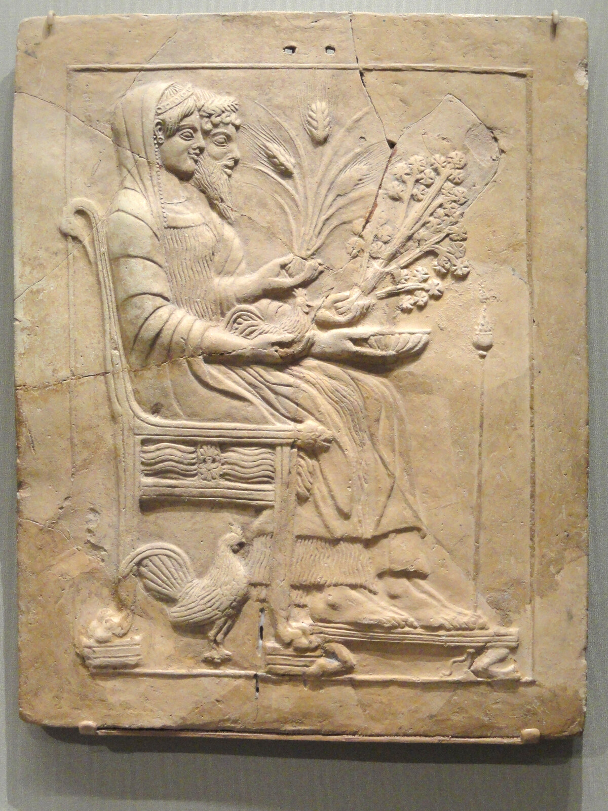 Ancient Greek terracotta plaque depicting enthroned Persephone and Hades.